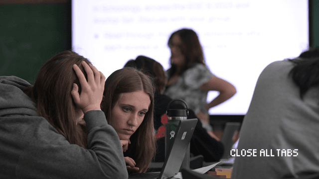 Two high school students discuss an essay for their English final exam at Thomas Jefferson High School in Denver, Colorado. (Hyoung Chang/The Denver Post)